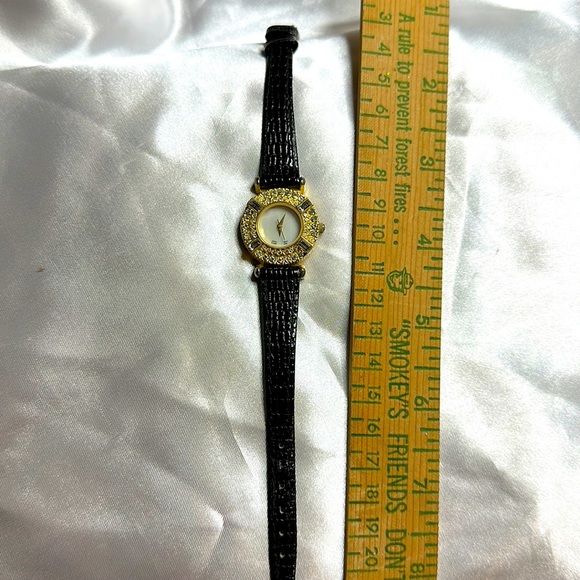 Black Embossed Leather with a Gold & Crystal Face/ needs battery.Has all stones. - Picture 1 of 5